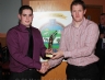 Dunloy Hurling Star Gregory O'Kane presents Daniel Hasson an award for Most Improved Hurler of the year